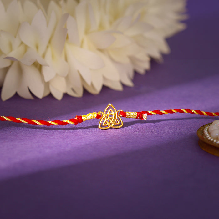 Golden Trinity Rakhi — image 1