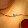 Silver Elegant Peacock Feather Rakhi — image 1