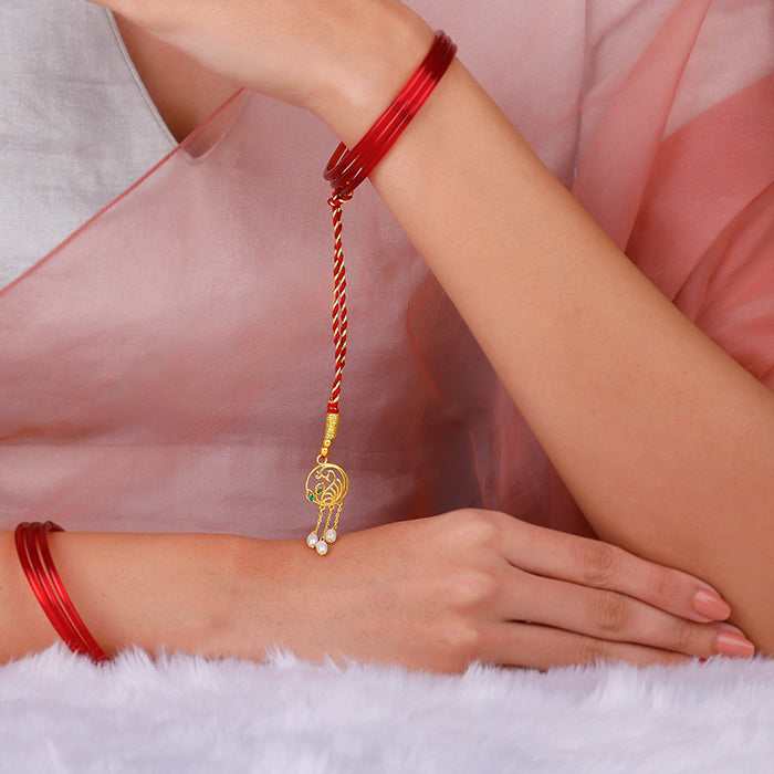 Golden Dangling Pearls Peacock Lumba Rakhi — image 2