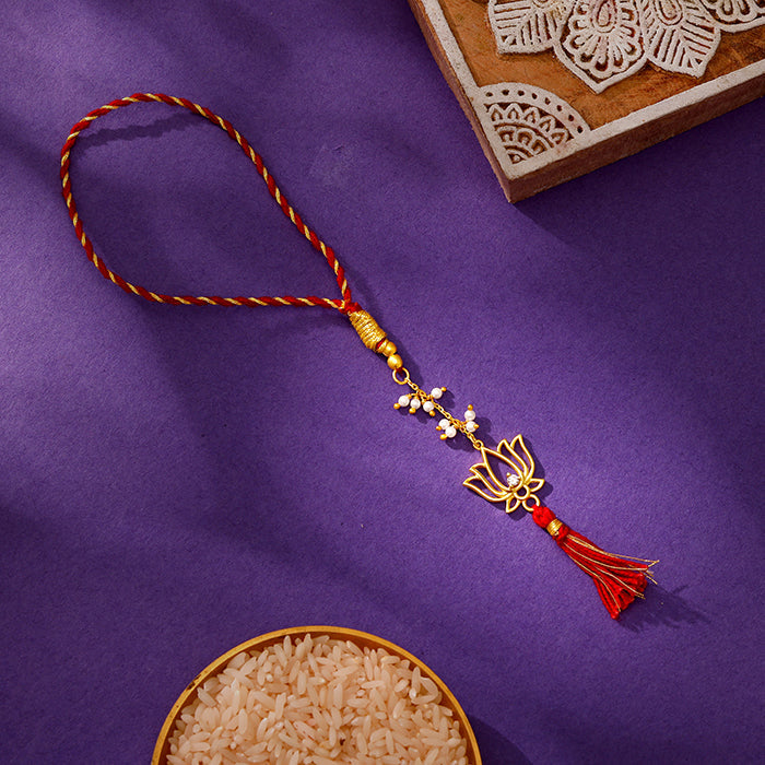 Golden Padmavati Lumba Rakhi — image 1
