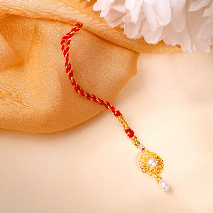 Golden Floret Pearl Lumba Rakhi — image 1