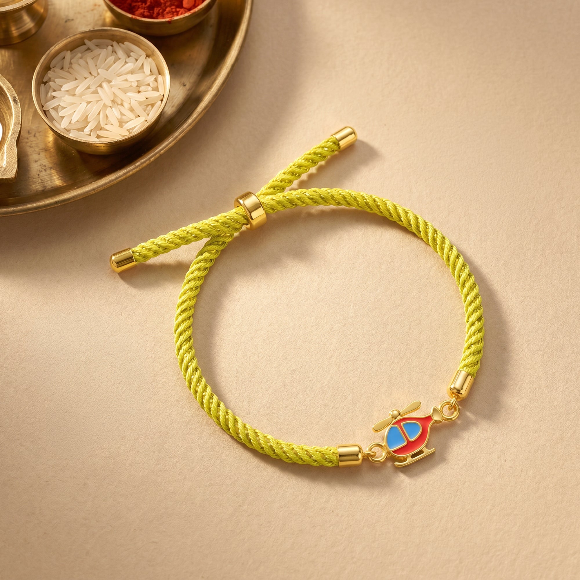 Golden Spinning Chopper Kids Rakhi — image 1