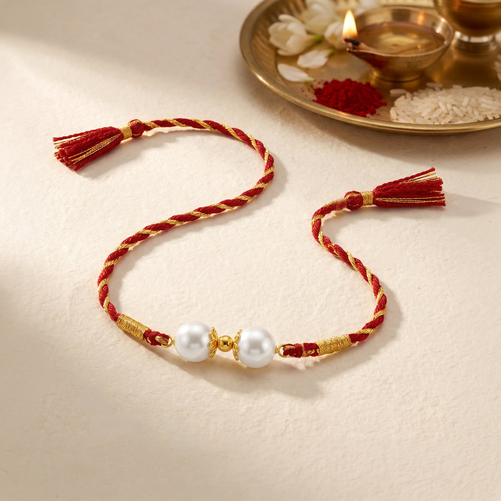 Gold Plated Twin Pearl Rakhi — image 1