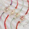 Fancy Pearl And Kundan Rakhi - Set Of 4
