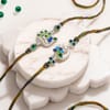 Silver-Plated Peacock Rakhi Set of 2